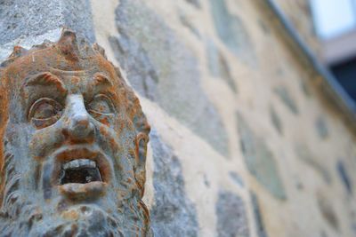 Close-up of statue against wall