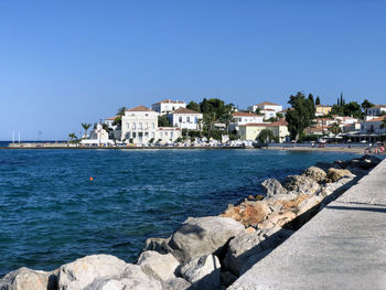 Scenic view of sea against clear blue sky