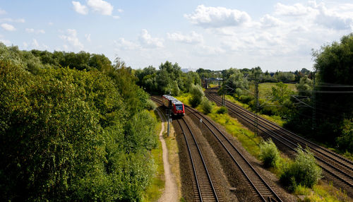 Train on railroad track against sky