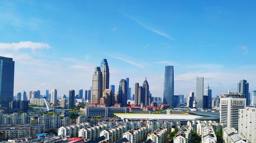 Panoramic view of buildings in city against sky