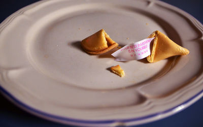 High angle view of fortune cookie on plate