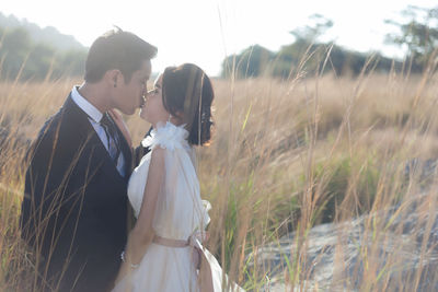 Close-up of couple kissing outdoors