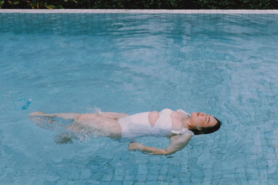 Woman swimming in pool