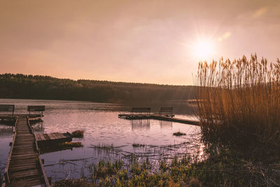 Scenic view of lake against sky during sunset