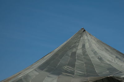 Low angle view of building against clear blue sky