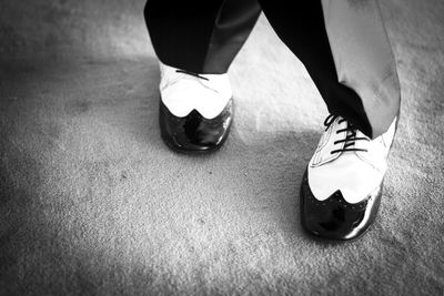 Low section of man dancing on floor