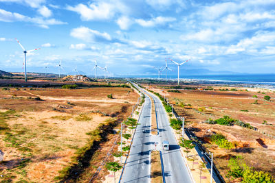 High angle view of road by sea against sky