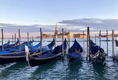 Boats moored in canal