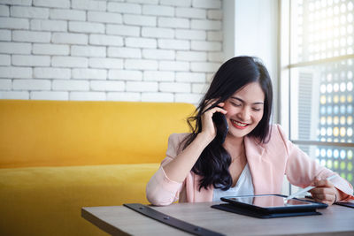 Young woman using mobile phone