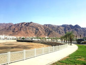 Scenic view of mountains against clear blue sky