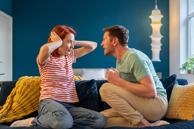 Side view of woman using mobile phone