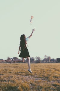 Woman standing on field