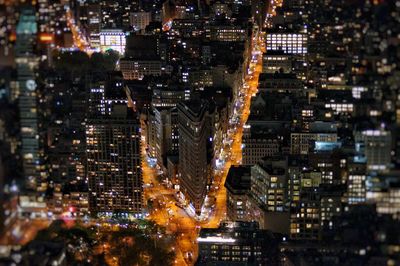 Illuminated buildings in city at night