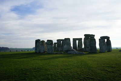 Built structure on field against sky