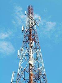 Low angle view of communications tower against sky