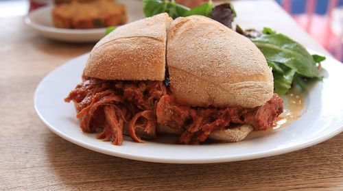 Close-up of brisket sandwich served on table