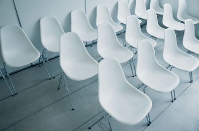High angle view of empty chairs on table