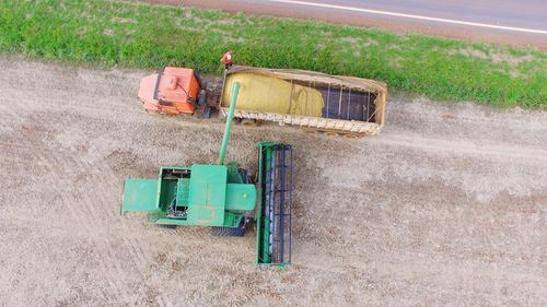 High angle view of tractors on ploughed field