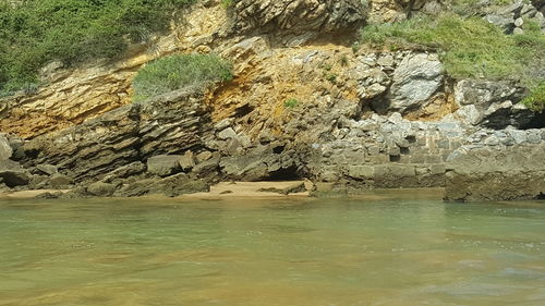 Scenic view of rock formation in sea