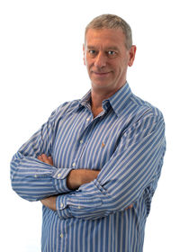 Portrait of smiling man standing against white background