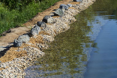 High angle view of stones in lake