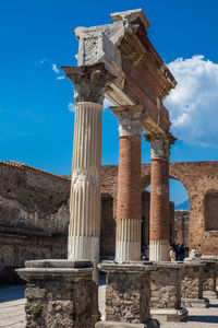 Tourists visiting the ruins of the ancient city of pompeii