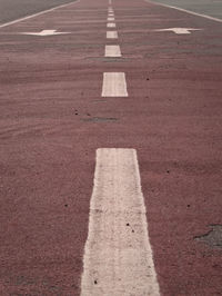 High angle view of arrow symbol on road