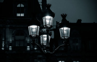 Low angle view of illuminated street light at night