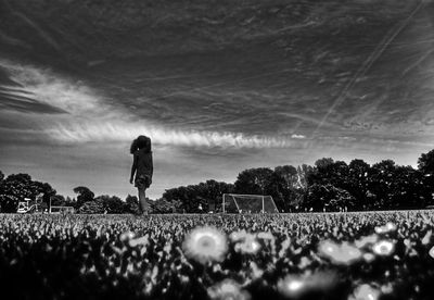 Crowd on field against sky at night