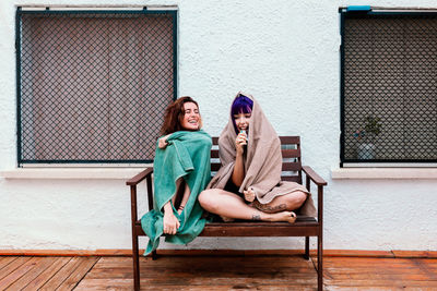 Two young women in the backyard in the summer having fun