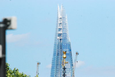 Low angle view of tower against clear blue sky