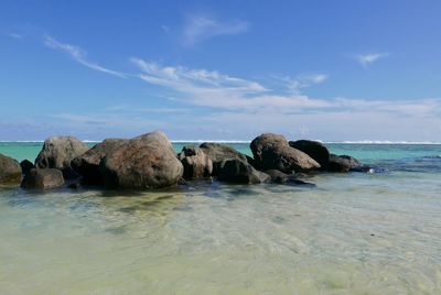 Scenic view of sea against blue sky