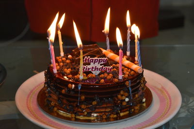 Burning candles on birthday cake