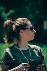 Young woman using smart phone outdoors