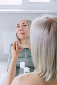 Portrait of young woman in bathroom