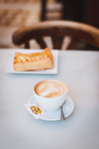 Close-up of cappuccino on table