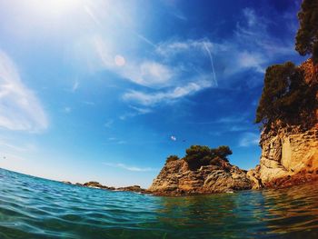 Panoramic view of sea against blue sky