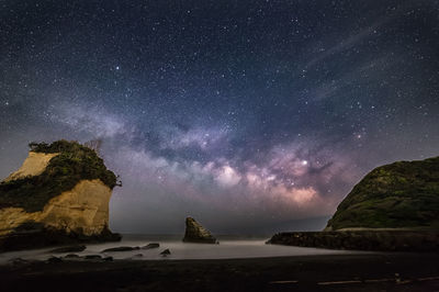 Scenic view of sea against sky at night