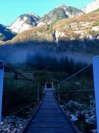 Footbridge leading towards mountains
