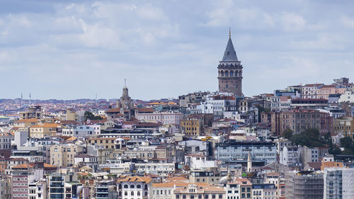 Cityscape of a part of istanbul city showing homes and galata tower from the harborside eminönü.