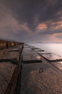 Scenic view of beach against sky during sunset