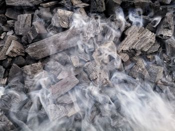 Full frame shot of charcoal smoking