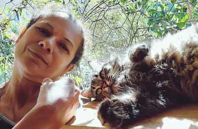 Portrait of woman with cat