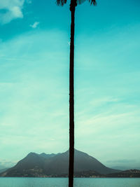 Scenic view of mountains against blue sky