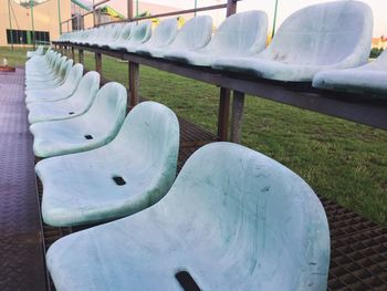 Empty chairs and tables in snow