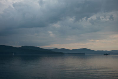 Scenic view of lake against sky during sunset