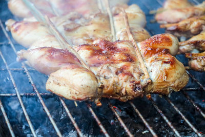 High angle view of meat on barbecue grill