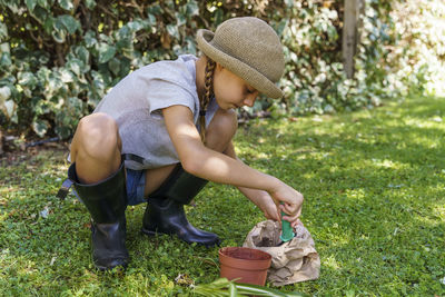 Side view of boy wearing hat