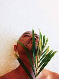 Close-up of man against white background