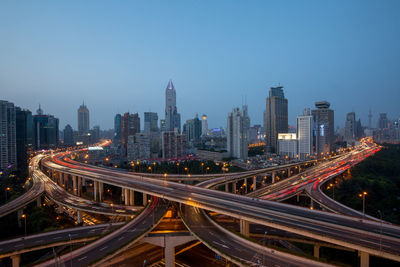 High angle view of light trails on road in city